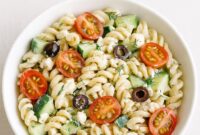 This chilled Greek yogurt pasta salad is a refreshing, protein-rich summer dish packed with cucumber, tomatoes, and olives in a tangy yogurt dressing.
