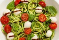 This chilled Greek yogurt pasta salad is a refreshing, protein-rich summer dish packed with cucumber, tomatoes, and olives in a tangy yogurt dressing.